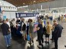 Attendees queue up at the ARRL booth to have their QSL cards checked for DXCC and other ARRL awards.