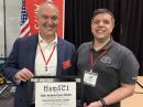 ARRL Director of Marketing and Innovation Bob Inderbitzen, NQ1R (L), receives a plaque from HamSCI Lead Dr. Nathaniel Frissell, W2NAF, following his keynote address at the 2025 HamSCI Workshop. [Rich Moseson, W2VU, photo]