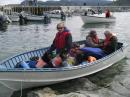 From the left: Cezar, Henry (the boatman) and Ken all packed up for the trip to Paul Island.