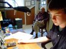 Bergren watches as ARRL Youth Editor Duncan MacLachlan, KU0DM, competes in the 2008 CQWW CW Contest from Bergren's home. [Photo courtesy of Duncan MacLachlan, KU0DM]