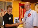 ARRL Membership and Volunteer Programs Manager Dave Patton, NN1N (right), congratulates under 30 (with <em>Rufz </em>experience) winner Cal Darula, K0DXC.